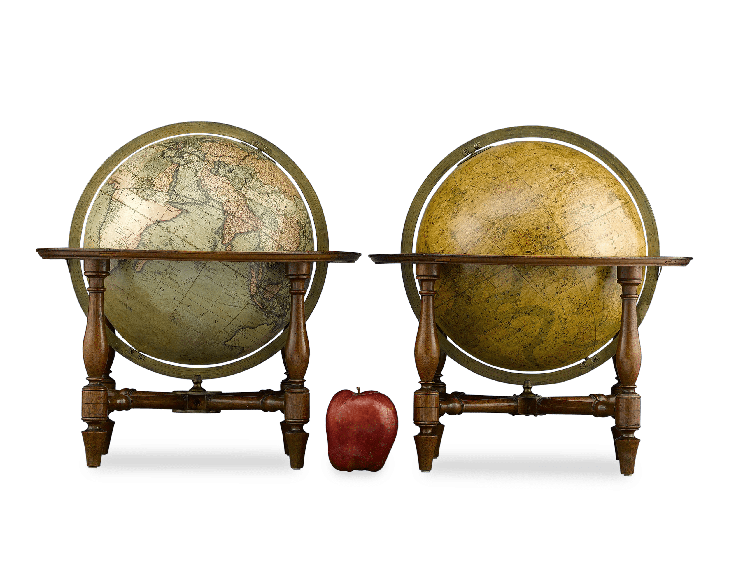 Each globe is held within an elegant mahogany stand
