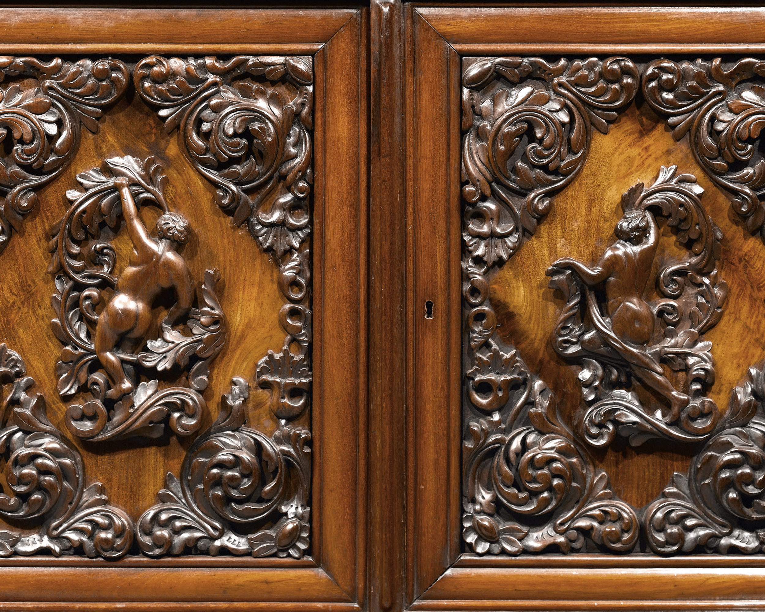 Figures dressed in traditional Dutch costume flank this wonderful bureau bookcase