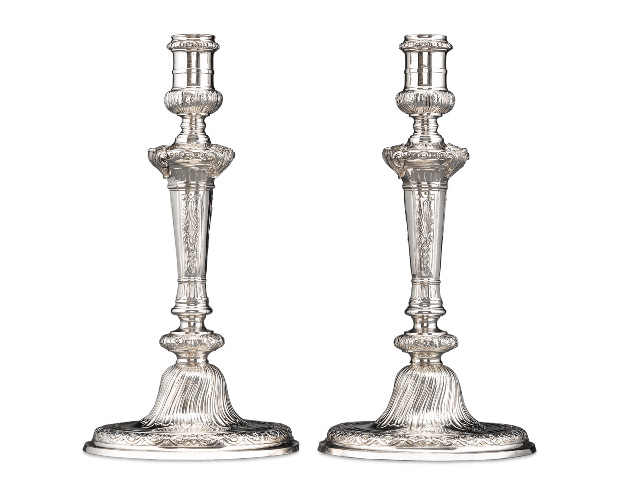 A well-balanced symphony of shells, palms, acanthus and rosettes adorns each piece