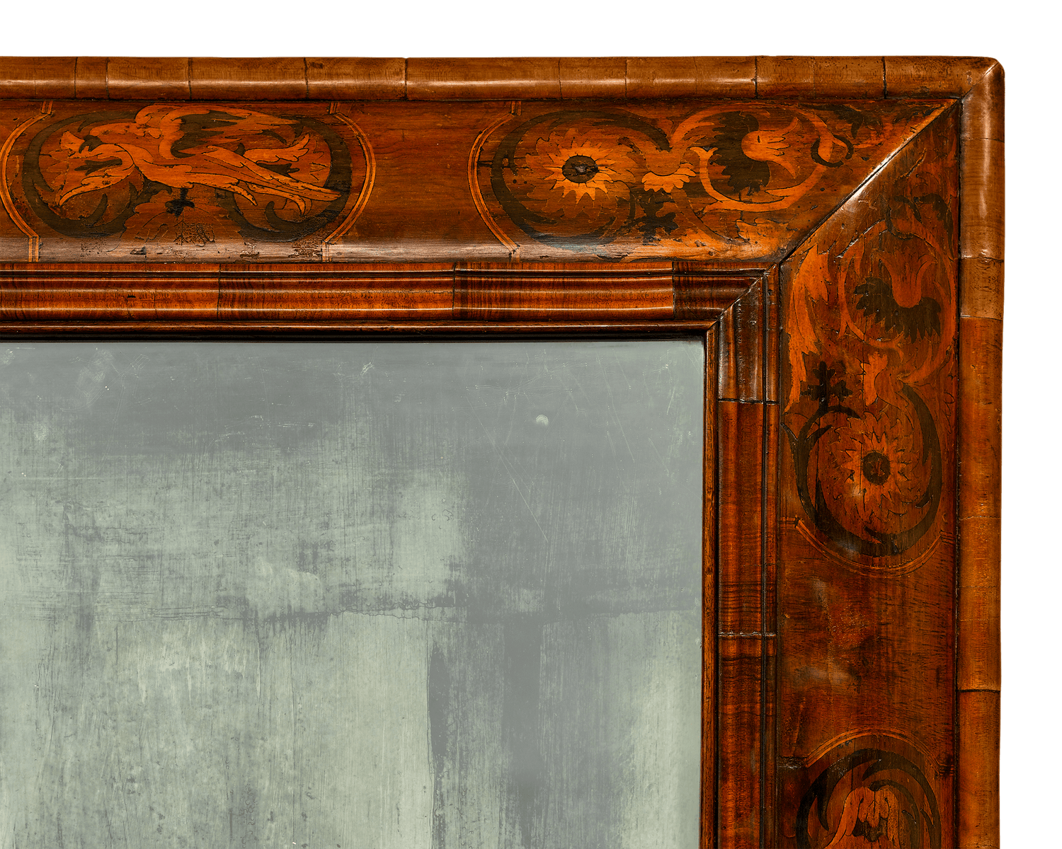 Incredible period marquetry surrounds this rare, all-original mirror