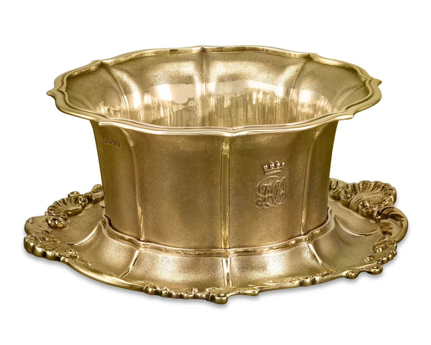 This elegant silver-gilt bowl features textured sides and intricate applied decoration