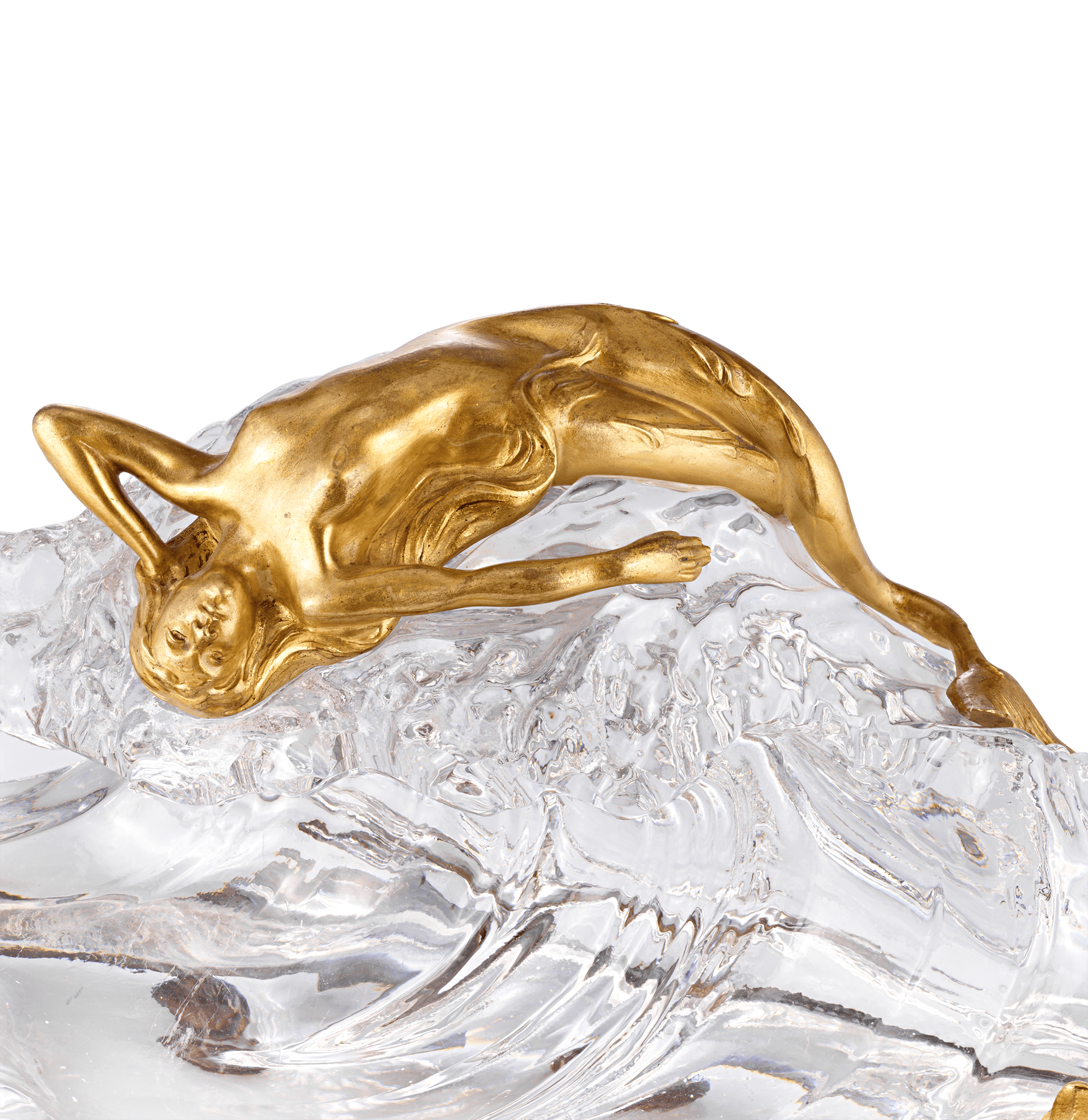 A seductive doré bronze mermaid reclines atop the crystal wave