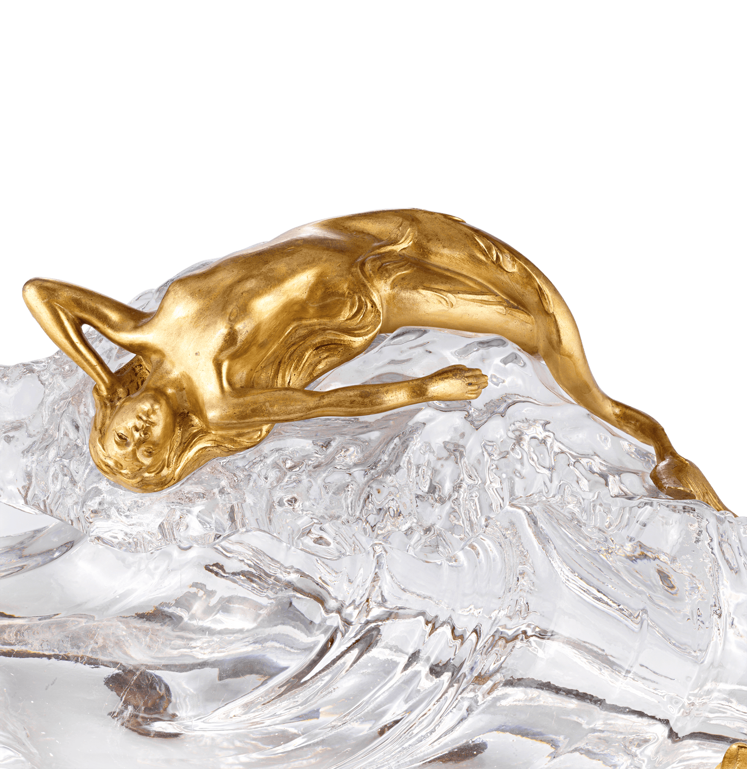 A seductive doré bronze mermaid reclines atop the crystal wave
