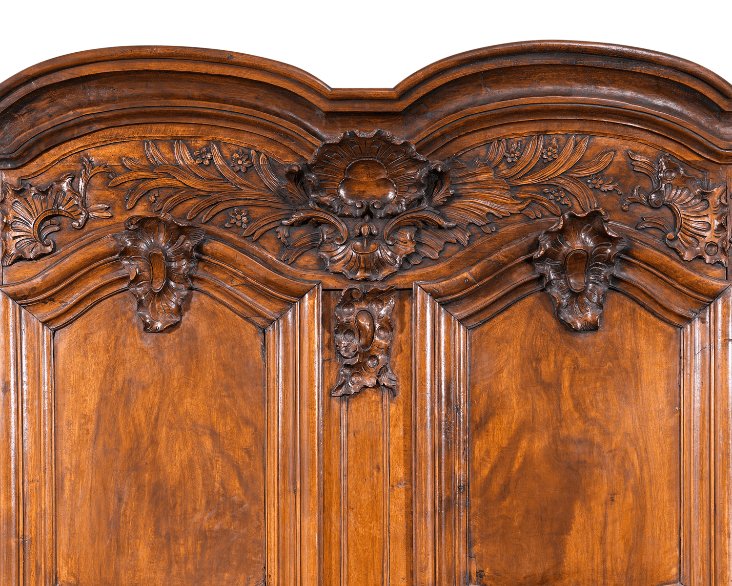 Robust rocaille carved flourishes add to the grandeur of this majestic cabinet