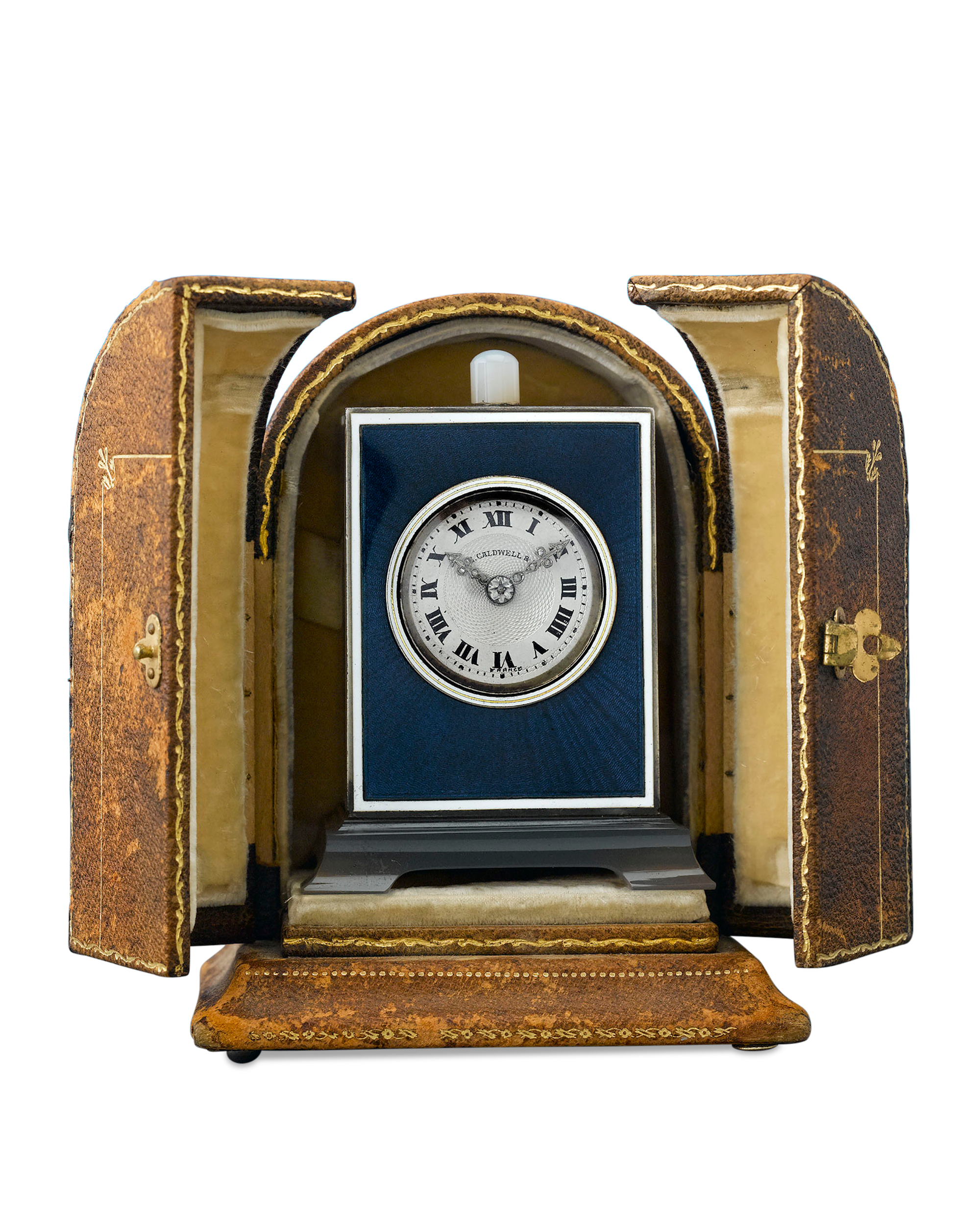 Retailed by J. E. Caldwell & Co., the clock is housed in its original leather case