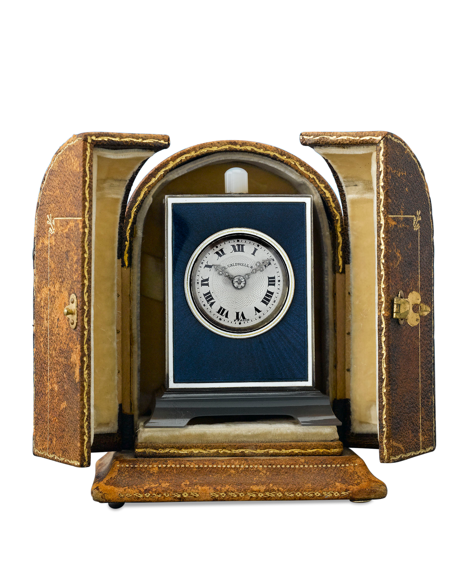 Retailed by J. E. Caldwell & Co., the clock is housed in its original leather case