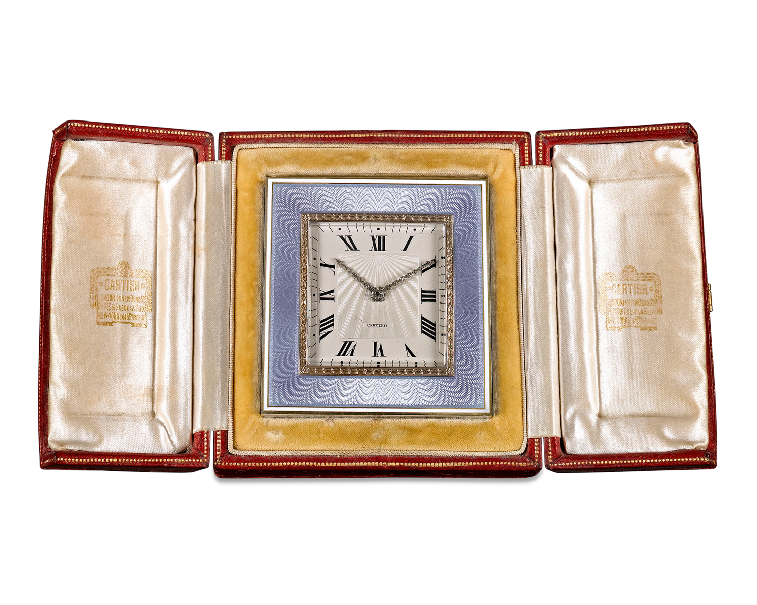 The clock can stand alone or be displayed in its original leather case