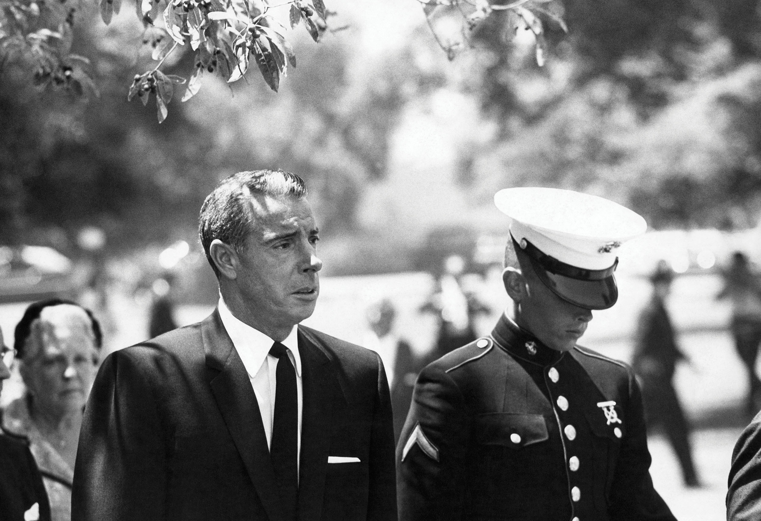 Monroe’s ex-husband, baseball legend Joe DiMaggio, with his son at her funeral, August 8, 1962