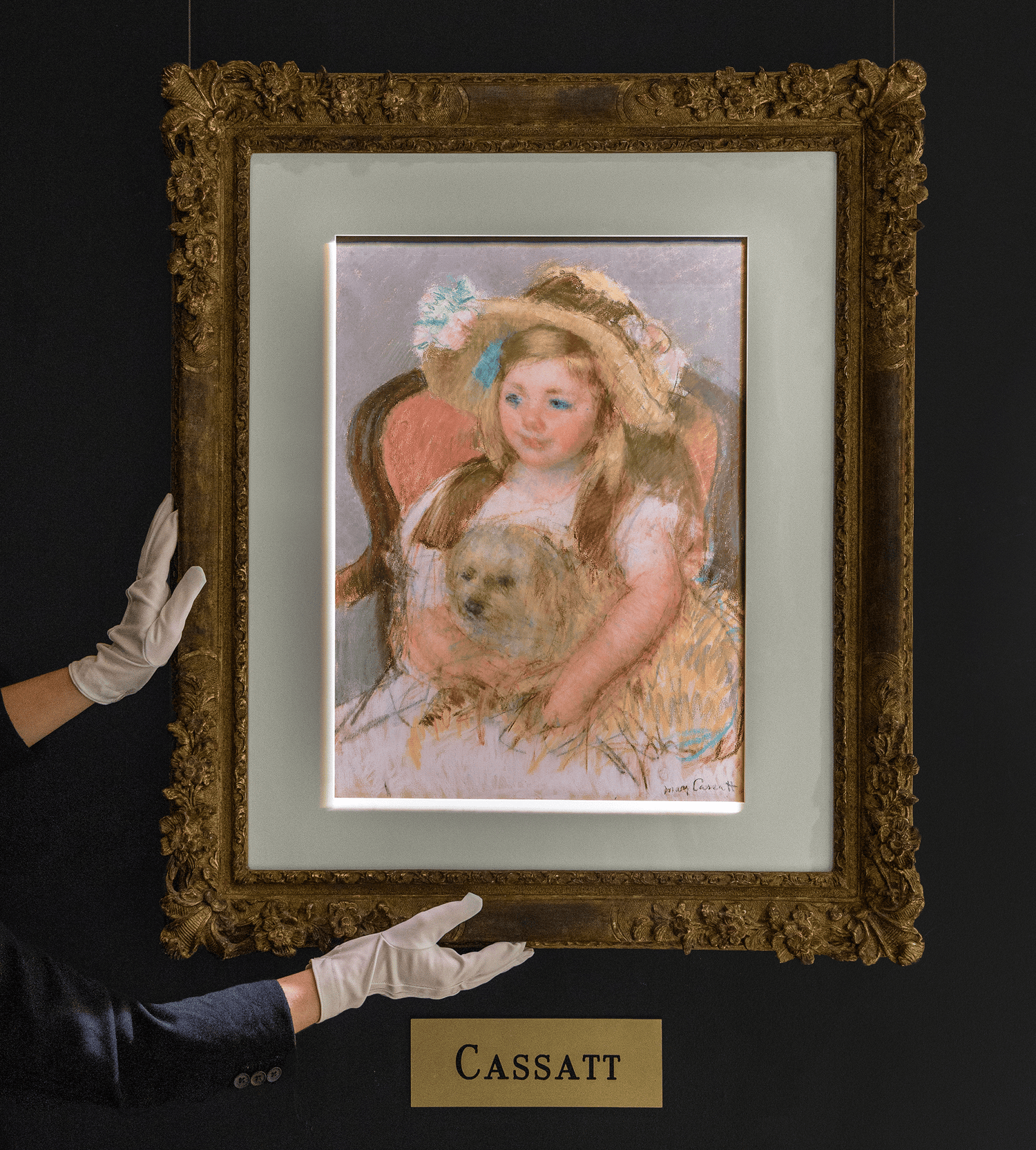 Smiling Sara in a Big Hat Holding Her Dog by Mary Cassatt